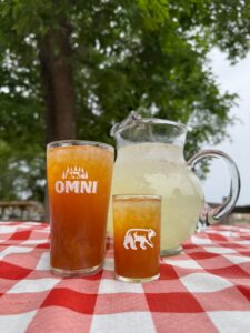 Raspberry puree, black iced tea and lemonade. Tastes like summer!