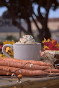 Our carrot cake latte surrounded by tasty decor.